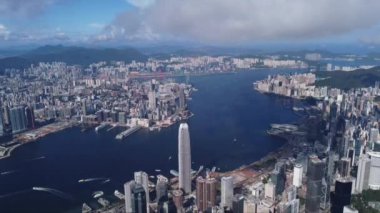A bird's eye view of cityscape of Hong Kong and the blue seascape