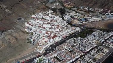 A beautiful view of a town with red roofed houses