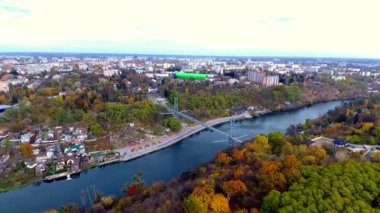 A bird's eye view of a bridge above a river flowing through Zhytomyr, Ukraine