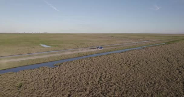 Aerial View Blue Truck Dirt Truck Middle Field Edge Stream — Stockvideo