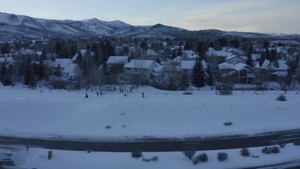 Aerial View People Walking Snowy Road Town — Stock Video