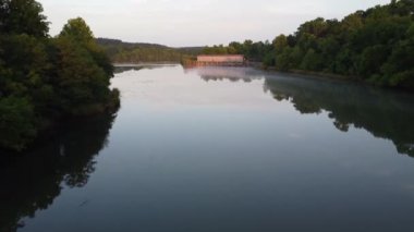 The drone footage of the river surrounded by green vegetation. Savannah Rapids Park, Georgia, USA.