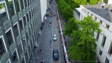 Helsinki Day city birthday event in the city, dinner with people eating in park and street