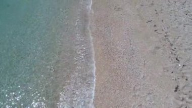 Drone footage of waves washing the coast