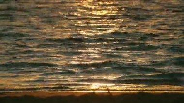 Closeup of the water during sunrise at Lanikai Beach in Honolulu, Hawaii.