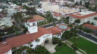 An aerial shot of a beautiful Santa Barbara city with green trees and beautiful architecture in California