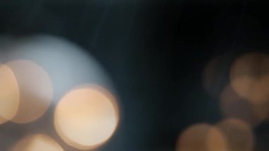 A beautiful view of rain on a bokeh light background