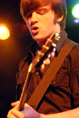 A portrait shot of Actor and singer Drake Bell performing live at The Roxy Theatre in Hollywood, Los Angeles, California