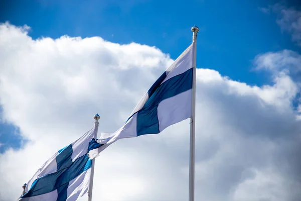 Low Angle Closeup Shot Finland Flags Waving Wind Blue Cloudy — Φωτογραφία Αρχείου