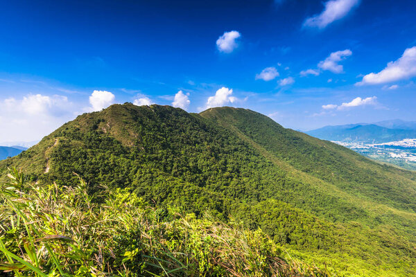 A beautiful view of mountain ranges with cloudy sky in the background
