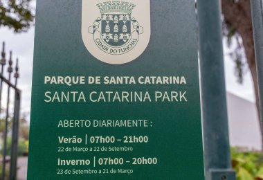 A closeup of a green direction sign in the Santa Catarina Park in Madeira Island
