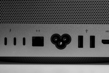 Power port and ethernet low key still life of modern new desktop computer system