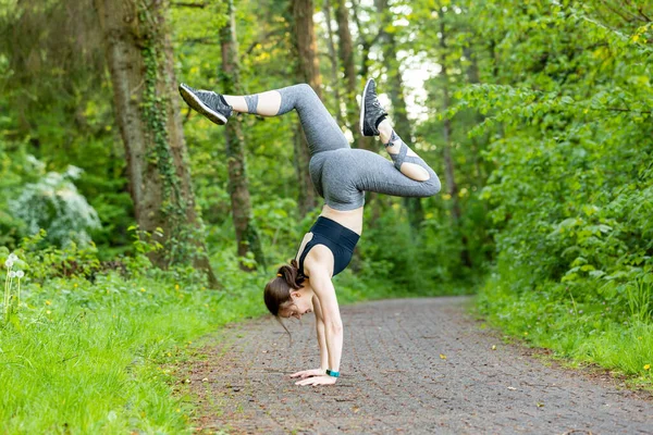 Young Caucasian Female Doing Handstand Path Forest — Foto Stock