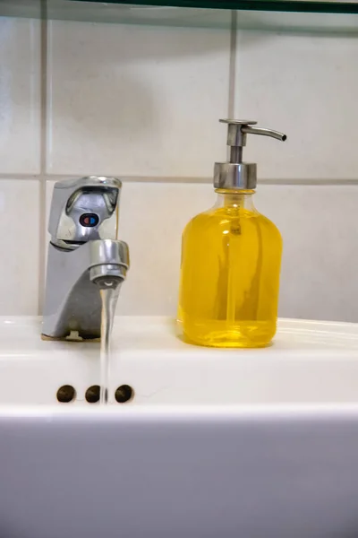 Vertical Shot Yellow Liquid Hand Soap Sink Bathroom White Wall —  Fotos de Stock
