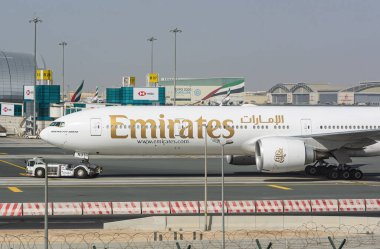 An Emirate Airline Boeing 777 300 ER parking in Dubai International Airport