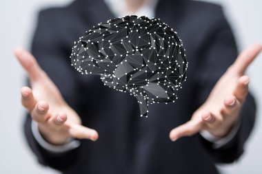 İnsan beyninin holografik bir şekilde avucunun içinde yüzen üç boyutlu görüntüsü.