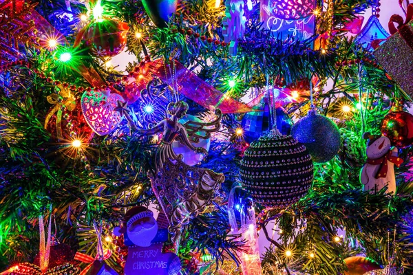 Closeup Shot Christmas Tree Branches Decorated Xmas Themed Figures Colorful — Fotografia de Stock
