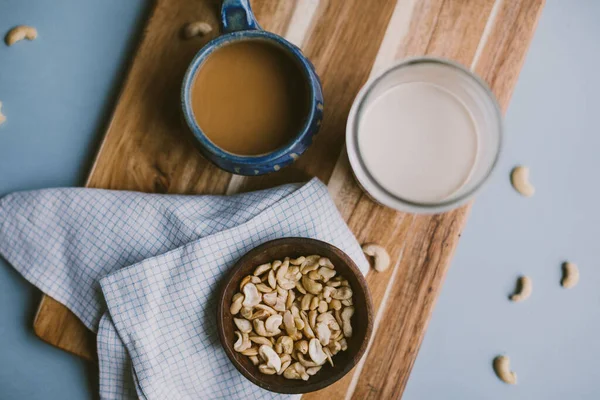 Top View Cup Coffee Milk Cashew Wooden Board — Photo