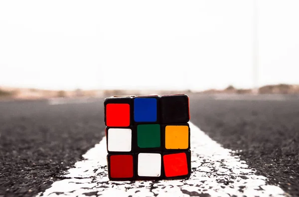 Rubik Cube Solved Asphalt Road — Stock Photo, Image