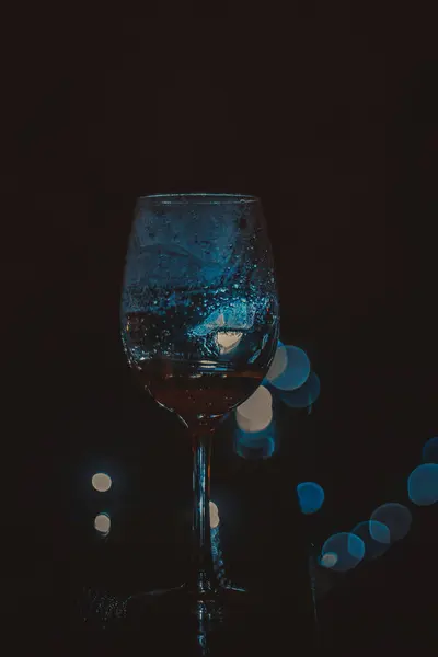 Vertical Shot Glass Wine Bokeh Lights Background — Stockfoto