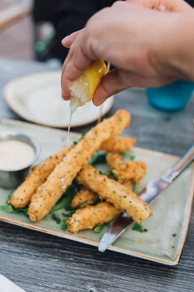 Woman Hands Squeezing Lemon Squid Calamari Sticks Steaks Plate Outdoor —  Fotos de Stock