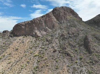A low angle shot of a high rocky mountain in Arizona