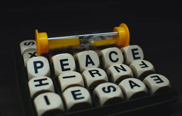 Closeup Word Peace Spelled Out Letter Cubes Sand Clock Black — Fotografia de Stock