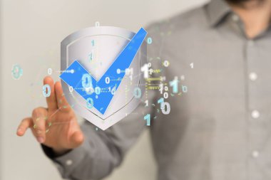 Bir kalkanın üç boyutlu görüntüsü ve holografik bir şekilde ikili kodlarla çevrili.