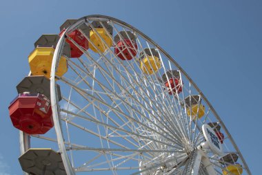 Colourful ferris wheel on the blue sky background in Santa Monica, Los Angeles
