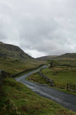 A cloudy Mountain road through the Kirkland Pass Lake District