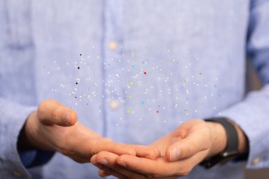 A 3D rendering of a network sphere levitating above a person's hands