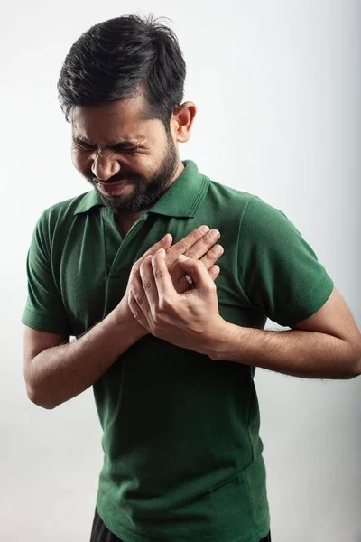 Young Handsome Guy Closing His Eyes Holding His Chest Suffering — Fotografia de Stock