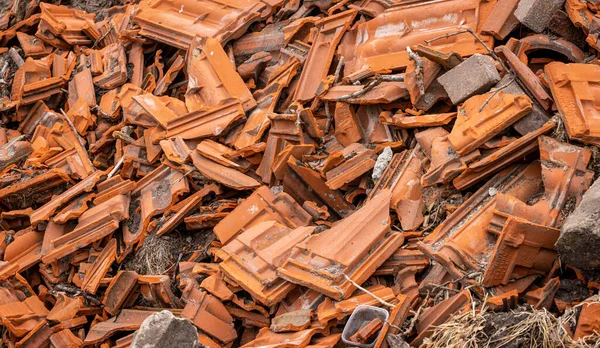 A pile of thrown away roofing tiles