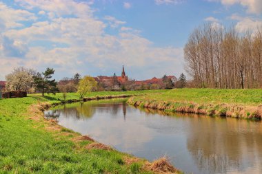 A meander of the Svratka river with view to the church at Uhercice, Czech republic
