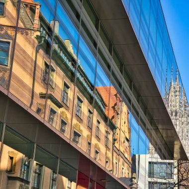 A vertical shot of an urban area with a modern building in Ulm City, Munster, Germany