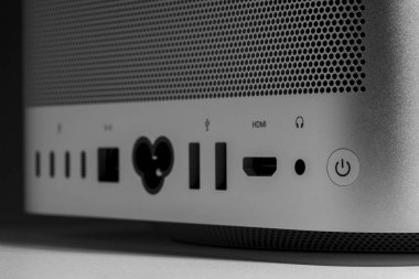 Macro closeup still life of desktop computer system with power button and all connection ports