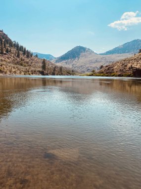A vertical scenic view of the Similkameen River in Oroville, Washington