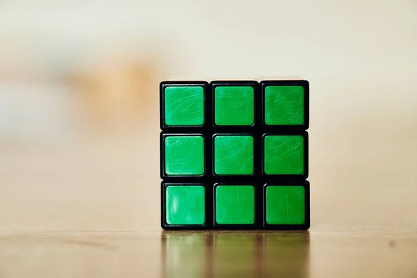 Solved Rubik Cube Standing Shiny Wooden Surface — Stock Photo, Image