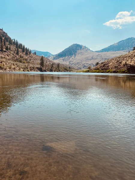 A vertical scenic view of the Similkameen River in Oroville, Washington