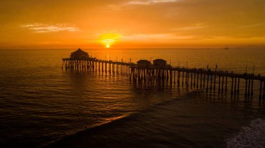 The beautiful view of Huntington Beach Pier at sunset. California, USA.