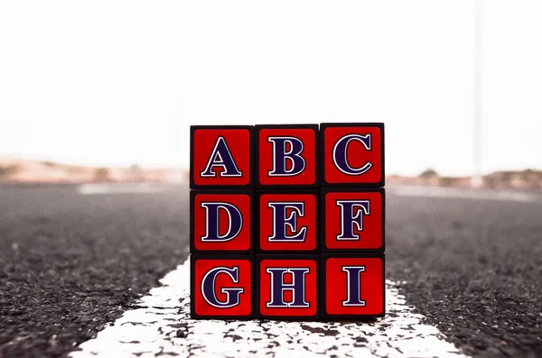 Rubik Cube Solved Asphalt Road — Stock Photo, Image