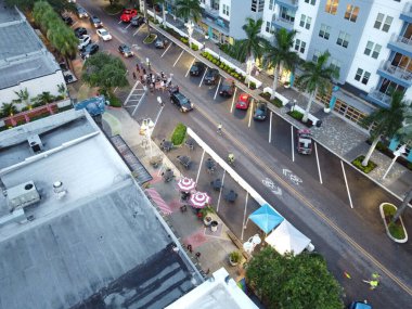 A downtown aerial view of people protesting on street.