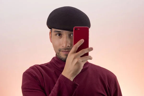 Latin Young Male Hat Using His Red Cell Phone — Foto de Stock