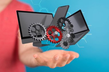 Bir elin yakınındaki resimli bilgisayarlara yakın çekim