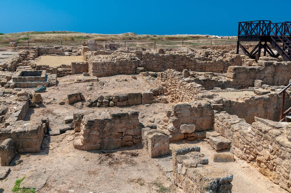 A closeup of land with old broken stones at the Cyprus Paphos Archaeological park