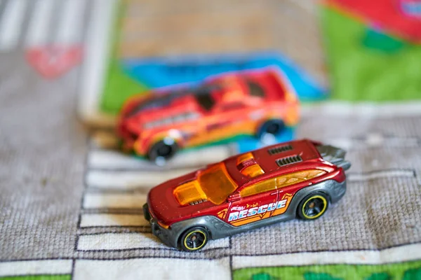 A view of Mattel Hot Wheels futuristic looking toy model cars on a play road mat