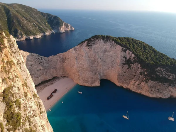 An aerial view of a beautiful coast and island during summertime