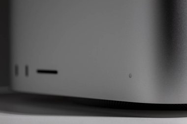 On indicator, thunderbolt and SD Card slot low key still life of new desktop computer system