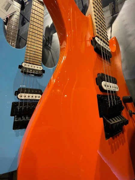 Augusta, Ga USA - 04 18 22: Guitar Center retail store blue and bright orange rock guitars