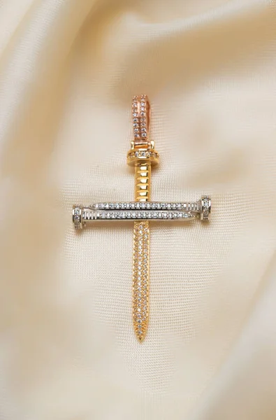Closeup Shot Golden Cross Diamond Stones Soft Beige Background — Stockfoto